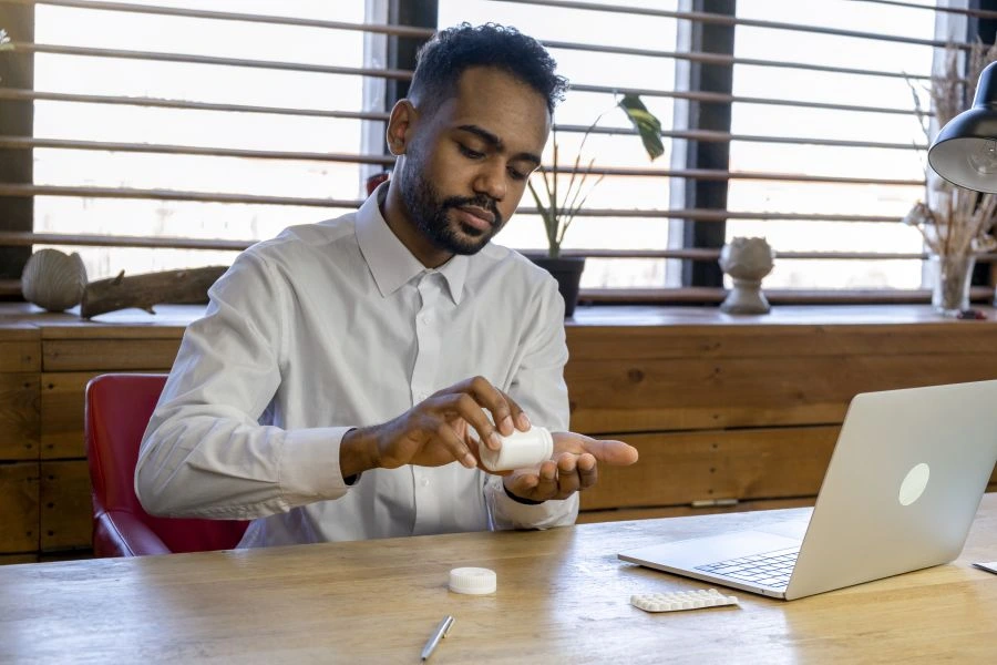 Man taking a supplement